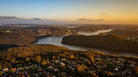 Sunset over suburbs of Sydney Australia, drone aerial view