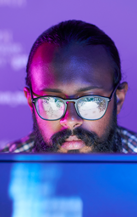 A man looking a a computer screen